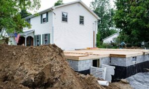 Residential home addition under construction, showing the site where construction staking is used